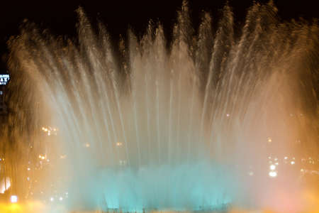 BARCELONA - JULY 25: Tourists at the Magic Fountain of Montjuïc (Font màgica de Montjuïc) and Palau Nacional on the Montjuïc, near Plaça dのeditorial素材