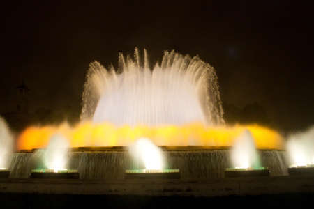 BARCELONA - JULY 25: Tourists at the Magic Fountain of Montjuïc (Font màgica de Montjuïc) and Palau Nacional on the Montjuïc, near Plaça d'Espanya on July 25, 2011 in Barcelona, Spainのeditorial素材