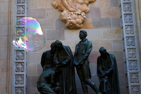 BARCELONA - MAY 14  Unknown street artist making giant soap bubbles and children playing with them on May 14, 2012 in Barcelona, Spainのeditorial素材