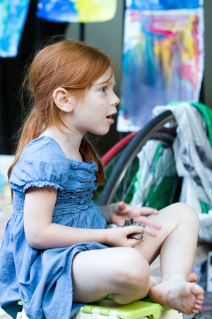 BUCHAREST - JUNE 15  Little girl having fun on Street Arthur Verona - Painter as part of Street Delivery 2012, on June 15, 2012 in Bucharest, Romaniaのeditorial素材