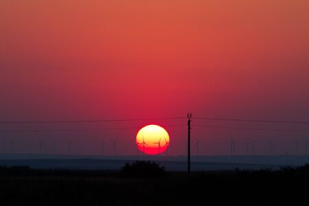 Sunset and windmills by the Black Seaの写真素材