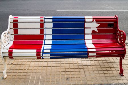 SANTIAGO - JANUARY 20  Painted benches by different artists on Isidora Goyenechea street in El Golf neighbourhood on January 20, 2013 in Santiago, Chileのeditorial素材