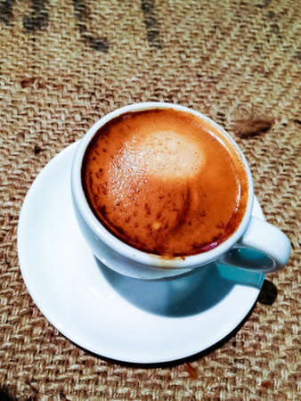 Espresso cups over coffee bag background