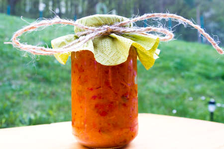 Rustic jars of home made delicacies  marmalade and pickles の写真素材