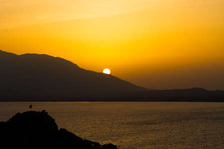 Sunset over sea and mountains in Datca, Turkey.の写真素材