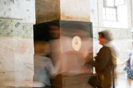 ISTANBUL, TURKEY - SEPTEMBER 23: People at the perspiring column (wishing, sweating, crying column) inside Hagia Sophia on September 23, 2014 in Istanbul, Turkeyのeditorial素材
