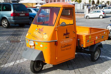 SIBIU - SEPTEMBER 09: Funny, colored food delivery car in the center of Sibiu, city designated the European Capital of Culture for the year 2007. Sibiu, Romania on 09 September 2015のeditorial素材