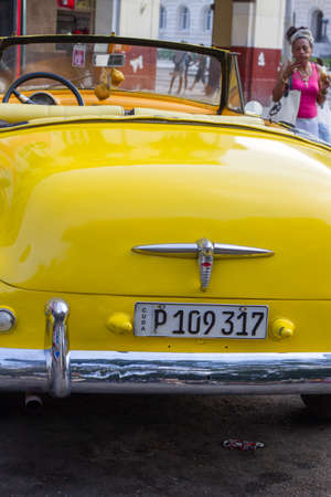 HAVANA - APRIL 27: People, cars and buildings in Old Havana (Havana Vieja), Havana, Cuba on April...