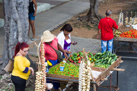 HAVANA - APRIL 27, 2016: People, cars and buildings in Old Havana (Havana Vieja)のeditorial素材