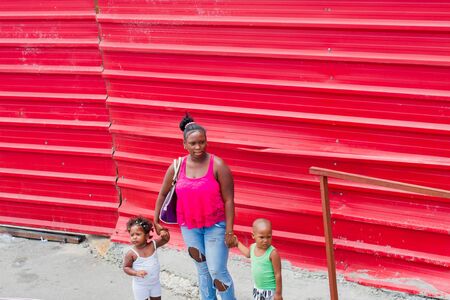 HAVANA - APRIL 27, 2016: People, cars and buildings in Old Havana (Havana Vieja)