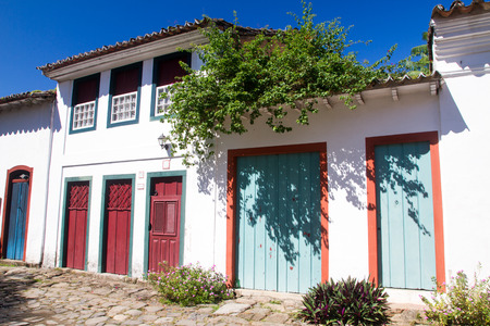 MARCH 27, 2016 - PARATY: Typical historical buildings with colorful wooden doors and windows in the colonial downtown of Paraty, Rio de Janeiro, Brazilのeditorial素材