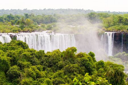 View of the Iguazu Iguacu) falls, the largest series of waterfalls on the planet, located between Brazil, Argentina, and Paraguay. At some times during the year one can see as many as 275 separate waterfalls cascading along the edges of 2,700 meters (1.6 の写真素材