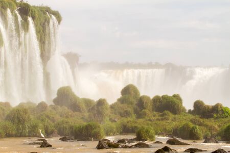 View of the Iguazu Iguacu) falls, the largest series of waterfalls on the planet, located between Brazil, Argentina, and Paraguay. At some times during the year one can see as many as 275 separate waterfalls cascading along the edges of 2,700 meters (1.6 の写真素材