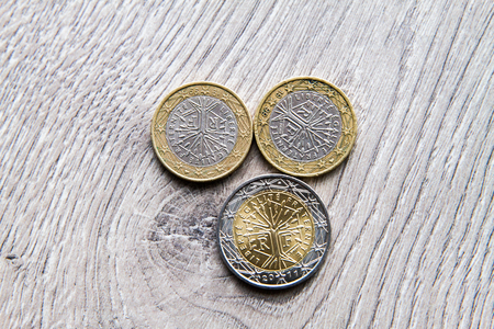 Mix of euros and cents on wooden backgroundの写真素材