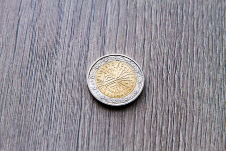 Mix of euros and cents on wooden background