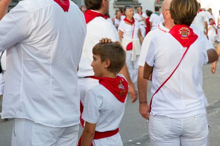 BAYONNE, FRANCE - JULY31: Unknown people dresses in traditional red and white clothes enjoying the "Fetes de Bayonne" festivals in the Northern Basque Country in the town of Bayonne, France on July 31st, 2017のeditorial素材