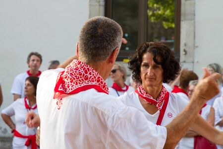 BAYONNE, FRANCE - JULY31: Unknown people dresses in traditional red and white clothes enjoying the "Fetes de Bayonne" festivals in the Northern Basque Country in the town of Bayonne, France on July 31st, 2017のeditorial素材