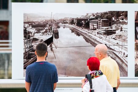 BILBAO - JULY 21: Tourists in front of the Guggenheim Museum Bilbao, museum of modern and contemporary art designed by Canadian-American architect Frank Gehry, in Bilbao, Basque Country, Bizkaia, Spain on July 21st, 2017のeditorial素材