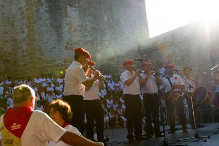 BAYONNE, FRANCE - JULY31: Unknown people dresses in traditional red and white clothes enjoying the "Fetes de Bayonne" festivals in the Northern Basque Country in the town of Bayonne, France on July 31st, 2017のeditorial素材