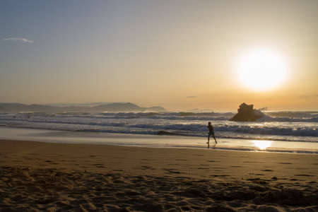 Sunset reflection in the ocean on Arrietara beach, Atxabiribil Sopelana, Basque Country (Euskadi), Spainの写真素材
