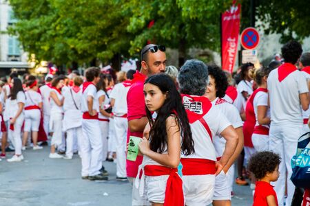 BAYONNE, FRANCE - JULY31: Unknown people dresses in traditional red and white clothes enjoying the "Fetes de Bayonne" festivals in the Northern Basque Country in the town of Bayonne, France on July 31st, 2017のeditorial素材