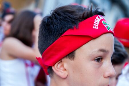 BAYONNE, FRANCE - JULY31: Unknown people dresses in traditional red and white clothes enjoying the "Fetes de Bayonne" festivals in the Northern Basque Country in the town of Bayonne, France on July 31st, 2017のeditorial素材