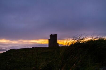Beautiful sunset landscape at the famous Cliffs of Moher and  O'Brien's Tower in Co. Clare, Europe, irelandの写真素材