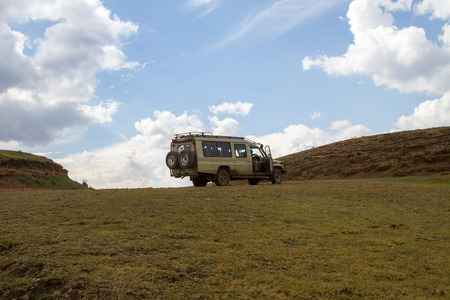 NGORONGORO - JANUARY 02: Safari car in Ngorongoro Conservation Area (NCA) World Heritage Site in the Crater Highlands, Tanzania on January 2nd, 2018のeditorial素材