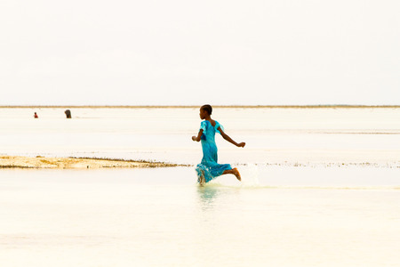 ZANZIBAR, TANZANIA - JANUARY 05: Unknown children playing on Paje beach, Zanzibar, Tanzania on January 5th, 2018のeditorial素材