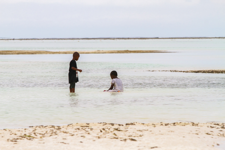 ZANZIBAR, TANZANIA - JANUARY 05: Unknown children playing on Paje beach, Zanzibar, Tanzania on January 5th, 2018のeditorial素材