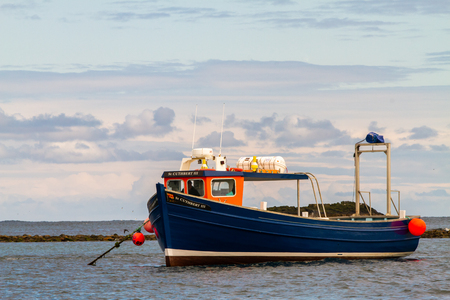 Farne Islands, UK - May 27, 2019: Tourist boats waiting, as tourists go bird watching during breeding period on May 27th, 2019 in Farne Islands, United Kingdomのeditorial素材