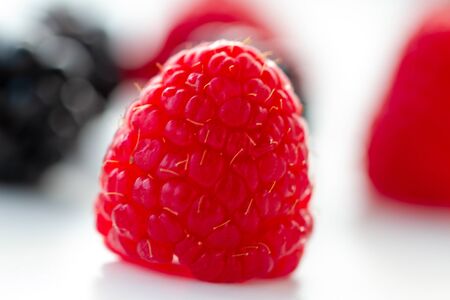 Berries - strawberries, raspberries, blueberries, blackberries - on white background in natural...
