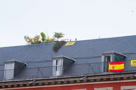 Madrid, Spain - May24 2020: Madrid buildings with Spanish flag and banners, as the city moves into phase1 after the total lockdown due to Coronavirus (COVID-19) infectious disease caused by Sars-cov-2のeditorial素材