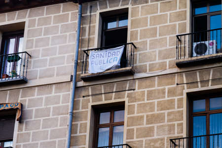 Madrid, Spain - May24 2020: Madrid residential building with Public Health banner, as the city moves...