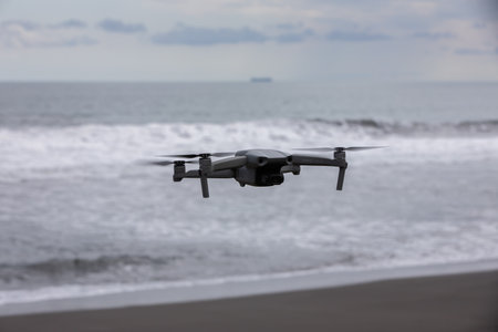 Puntarenas, Costa Rica - April 20: Drone over the black, volcanic beach and Pacific ocean waves at Playa Hermosa in North Puntarenas, Costa Rica on April 20, 2021のeditorial素材