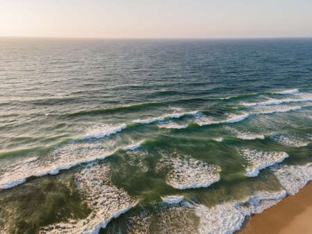 View of the Atlantic ocean and Praia d`El Rey beach at sunset, near Obidos, Portugalの写真素材