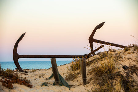 The arrangement of anchors memorial to the lost tuna fishing industry that once thrived there and were used to keep the nets in place as opposed to mooring the boats at the Anchor Graveyard in Praia do Barril, Tavira, Portugalの写真素材
