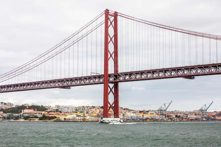 Lisbon, Portugal - October 24-30, 2020: View of the 25thÂ of April Bridge, in the capital and the largest city of Portugal, between October 24th and 30th, 2021 in Lisbon, Portugalのeditorial素材