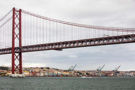 Lisbon, Portugal - October 24-30, 2020: View of the 25thÂ of April Bridge, in the capital and the largest city of Portugal, between October 24th and 30th, 2021 in Lisbon, Portugalのeditorial素材