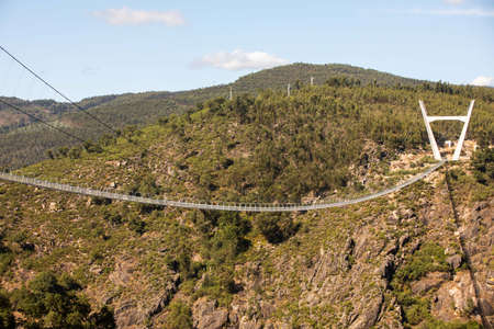 Arouca, Portugal - August 6, 2021 - The 516 Arouca Bridge, largest pedestrian suspension bridge in the world, suspended 175 m above the Paiva River, in Arouca, Aveiro, Portugal on August 6th, 2021のeditorial素材