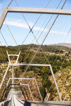 Arouca, Portugal - August 6, 2021 - The 516 Arouca Bridge, largest pedestrian suspension bridge in the world, suspended 175 m above the Paiva River, in Arouca, Aveiro, Portugal on August 6th, 2021のeditorial素材