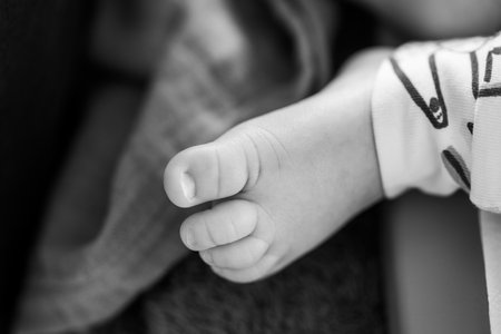 Close-up of a newborn baby with focus on different body partsの写真素材