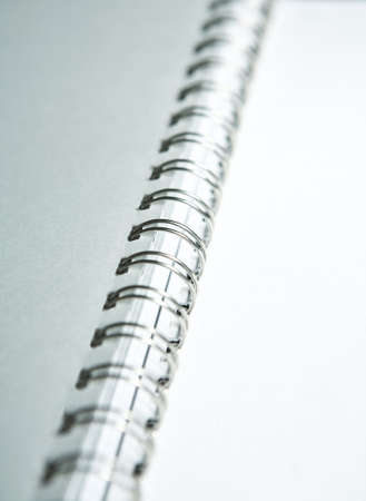 Metal binding of paper pages on a white backgroundの写真素材