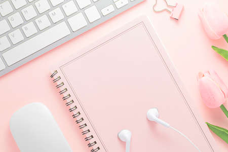 Office desk table top view with office supply, pink table with copy space, pink color workplace...