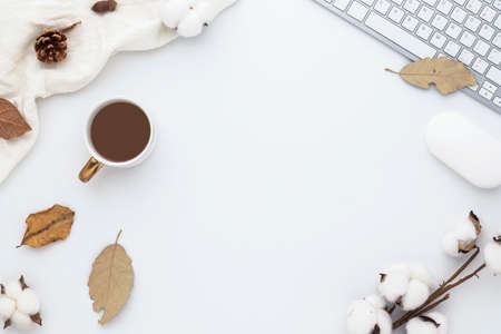 Autumn composition, office supplies, coffee cup. dried leaves. and pine cones on white background. Flat lay, top view with copy spaceの写真素材