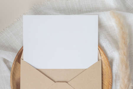 Blank paper cards, Blank greeting card invitation Mockup with craft envelope, Dried Bunny Tail grass...