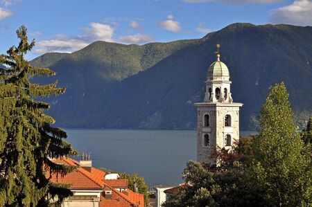 View from Lugano, Switzerland with church tower and lake.の写真素材