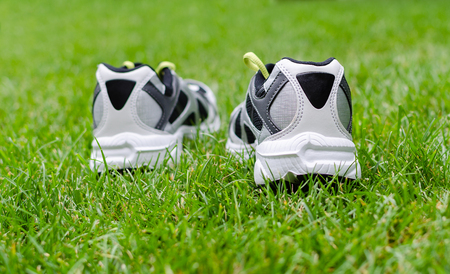 White sneakers on grassの写真素材