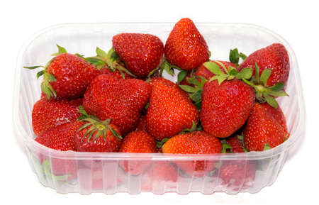 transparent plastic tray with freshly picked strawberries.の写真素材