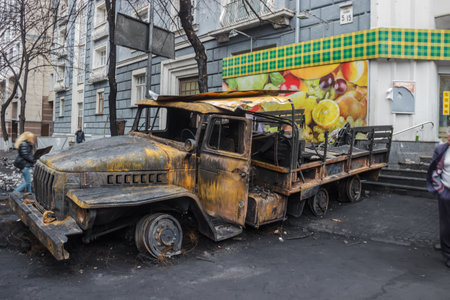 Kiev, Ukraine - February 22, 2014: Burnt truck in the city center after the cessation of military actions.のeditorial素材